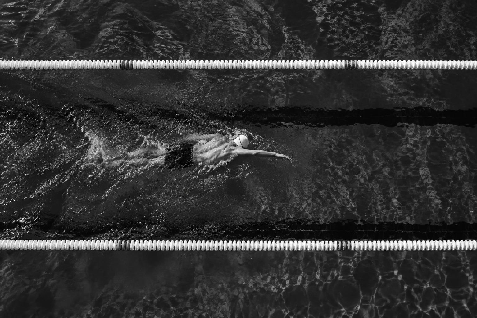 A swimmer training alone in a pool